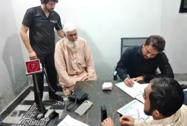 Dr Gulfam Checking Patient on free camp at Hashmi Hospital