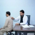 Dr Gulfam Checking patient