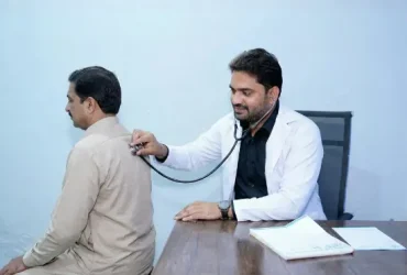 Dr Gulfam Checking patient